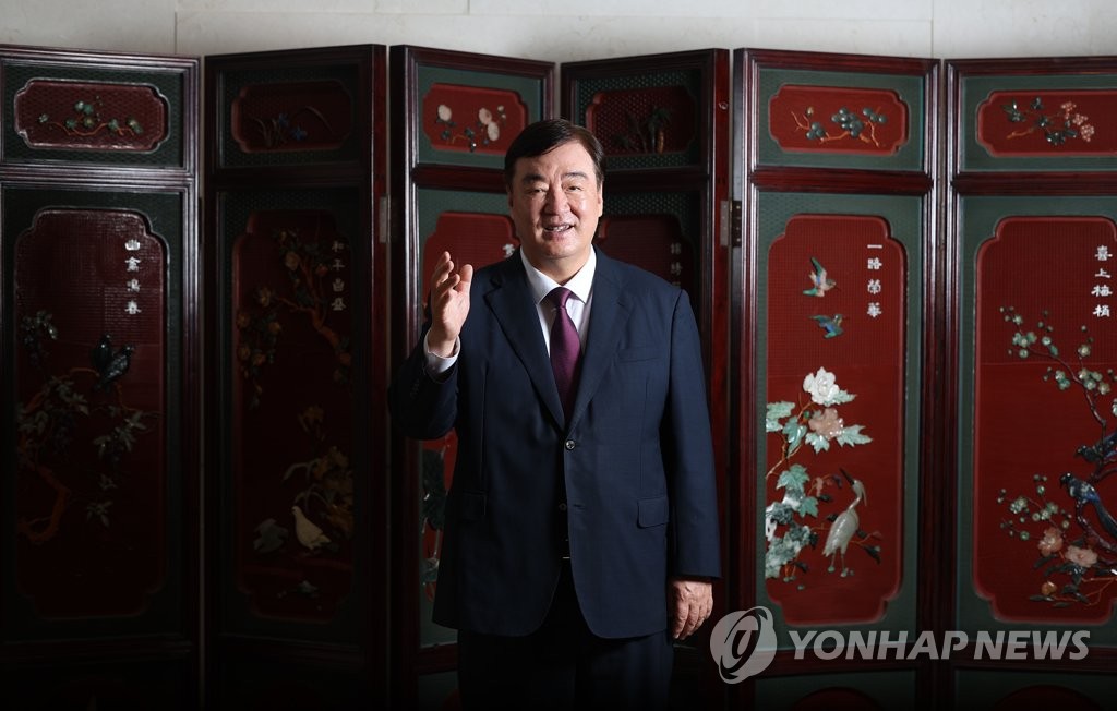 Chinese Ambassador to South Korea Xing Haiming poses for a photo following an interview with Yonhap News Agency on Aug. 18, 2023. (Yonhap)