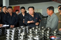 N.K.'s No. 2 man inspects factory
