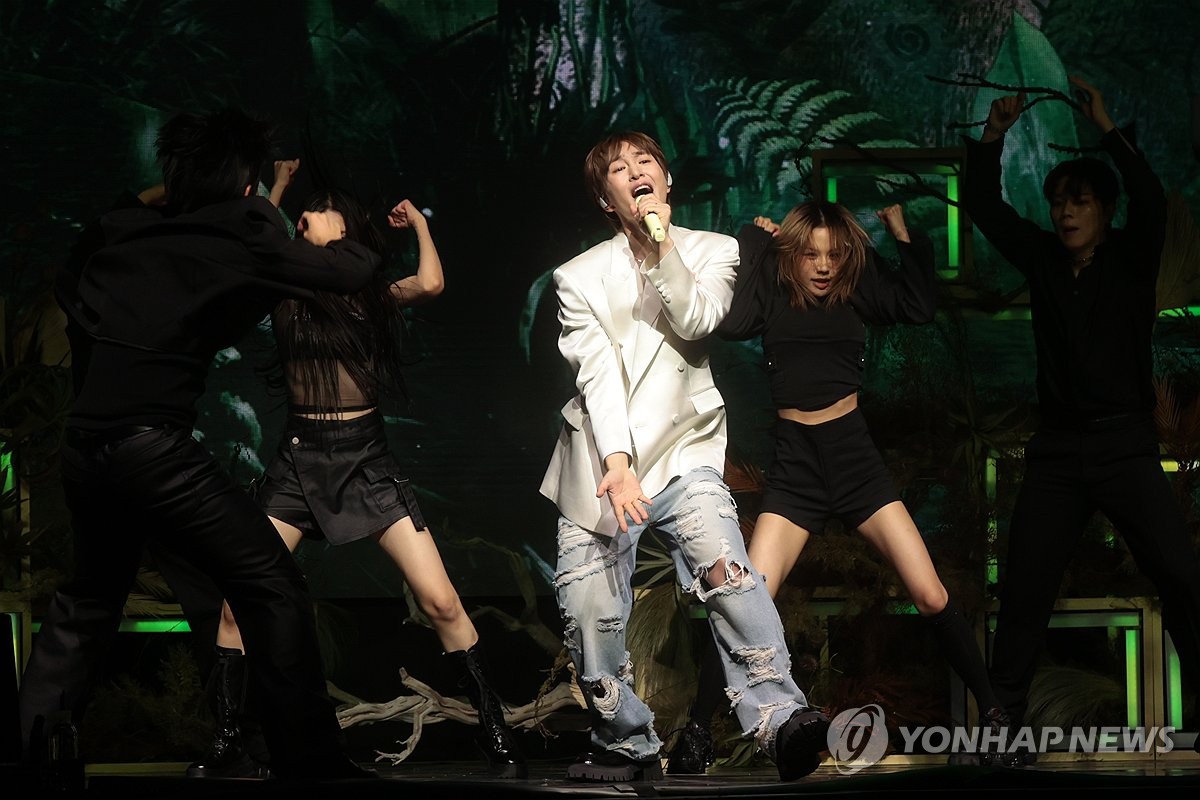 Singer Onew performs